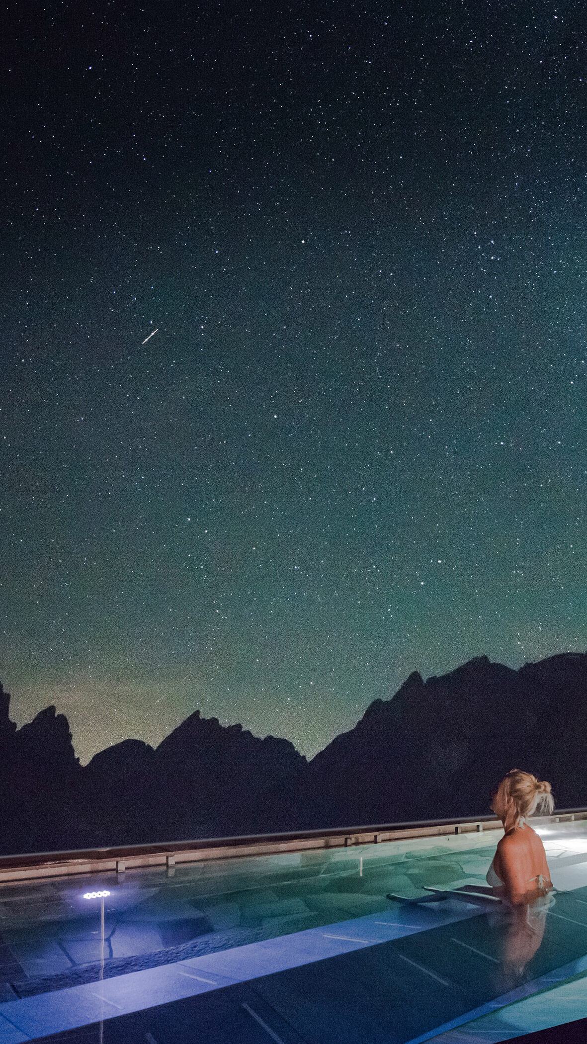 Woman watching in the skypool watching the stars