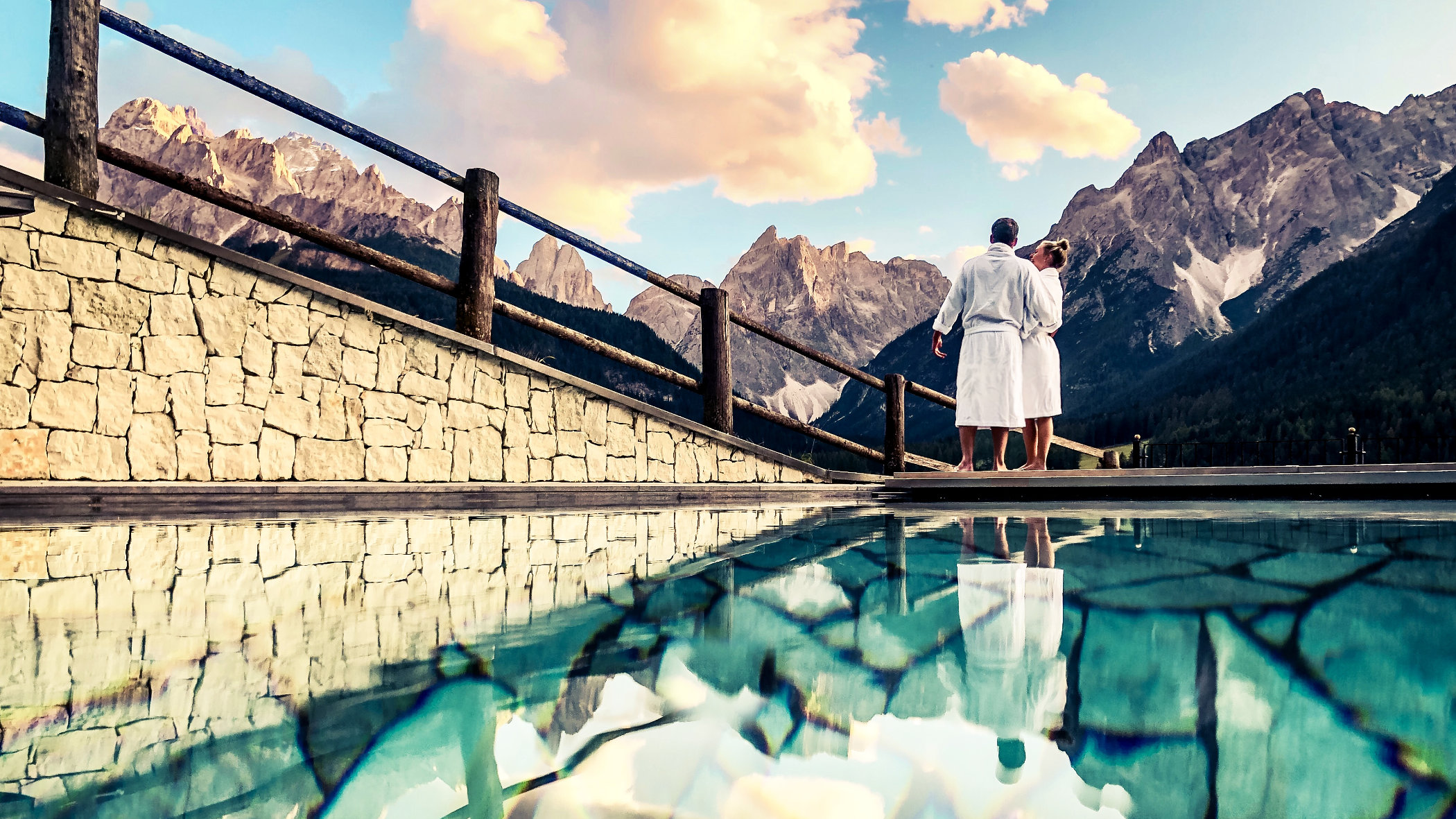 Berghotels outdoor pool with view of the Sextner Dolomites