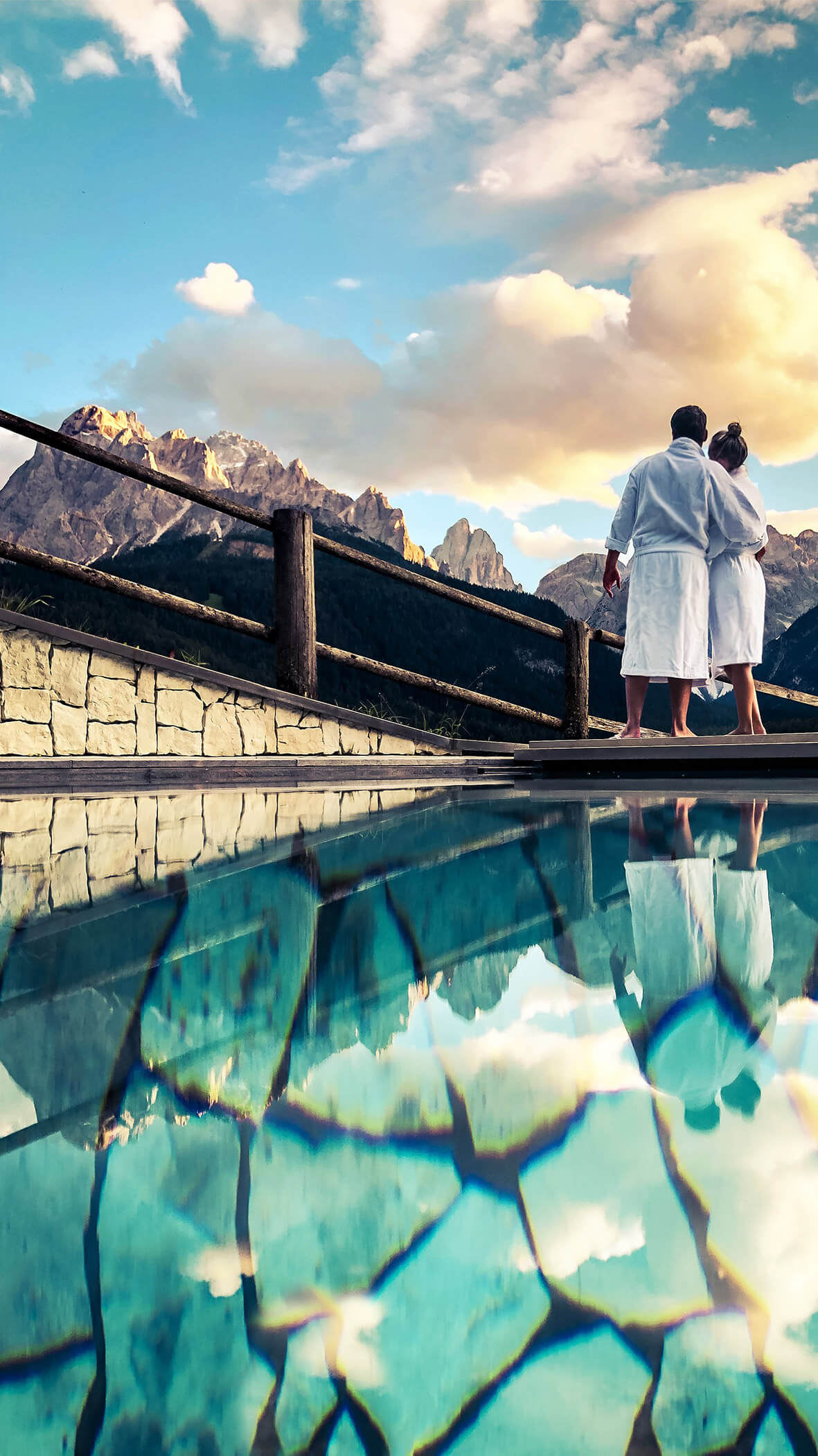 Berghotels outdoor pool with view of the Sextner Dolomites